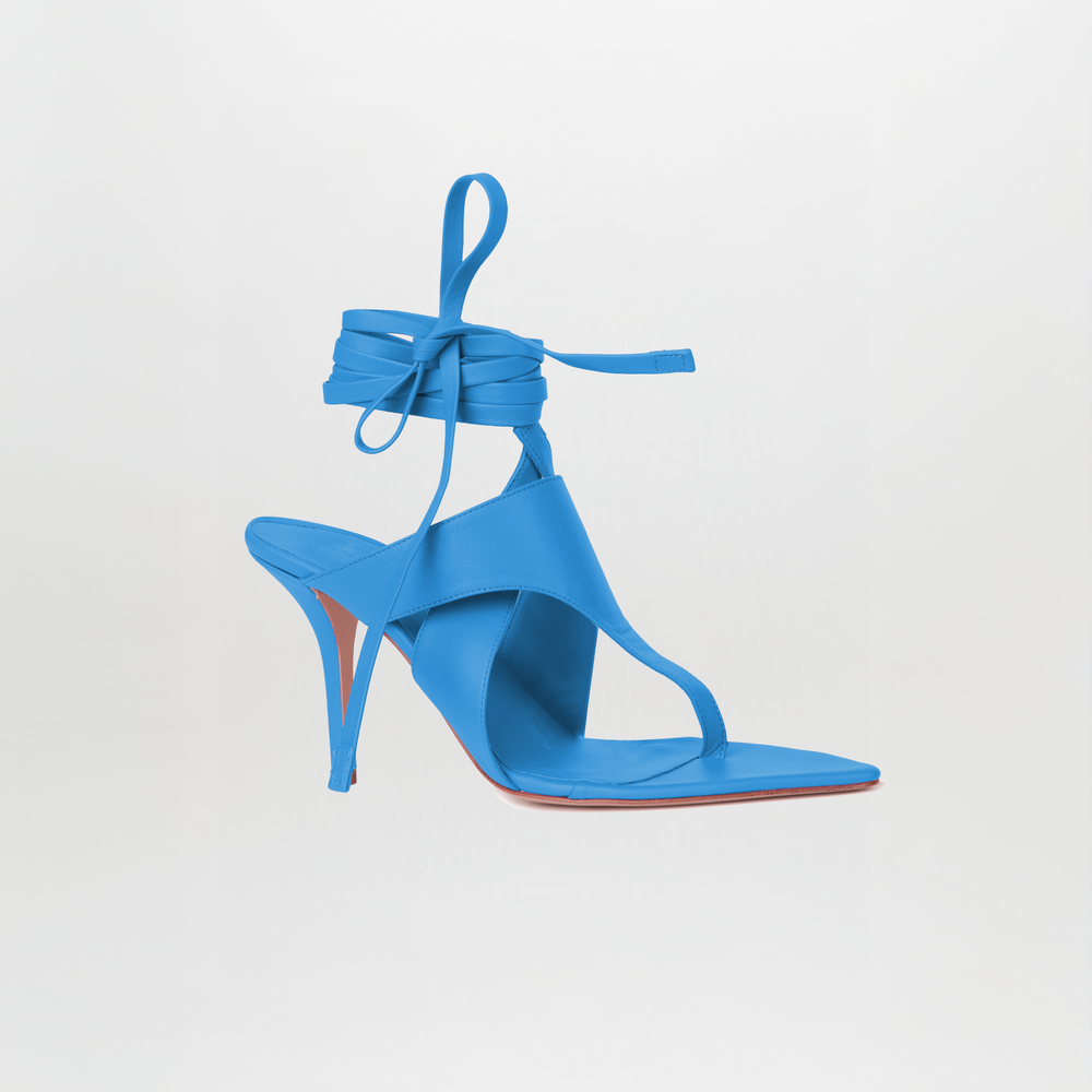 The Domenico Heels Cool Sky by GIA Couture are bright blue Italian leather sandals with a square toe, open heel, and long ankle wrap straps, shown against a plain white background.