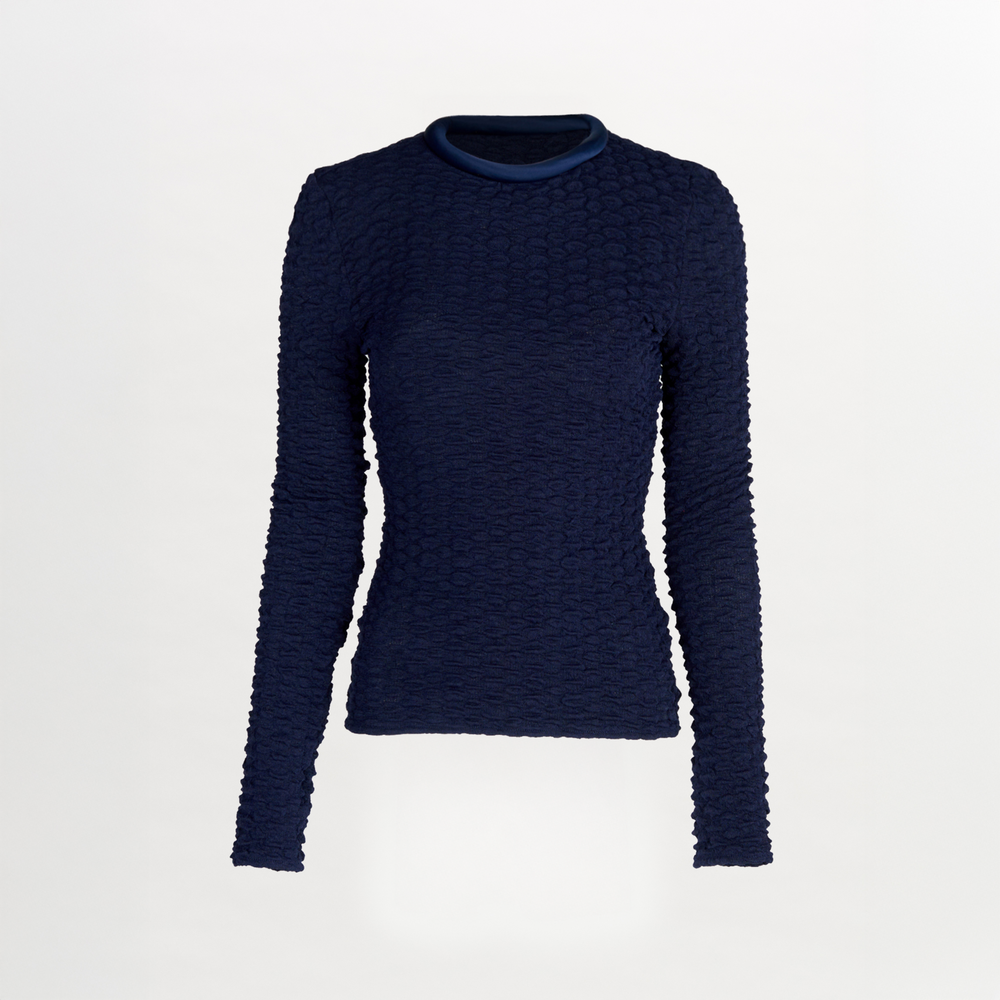 A women's long-sleeved Jari Top Navy, crafted from jacquard fabric, making it a versatile piece for Resort 2024.