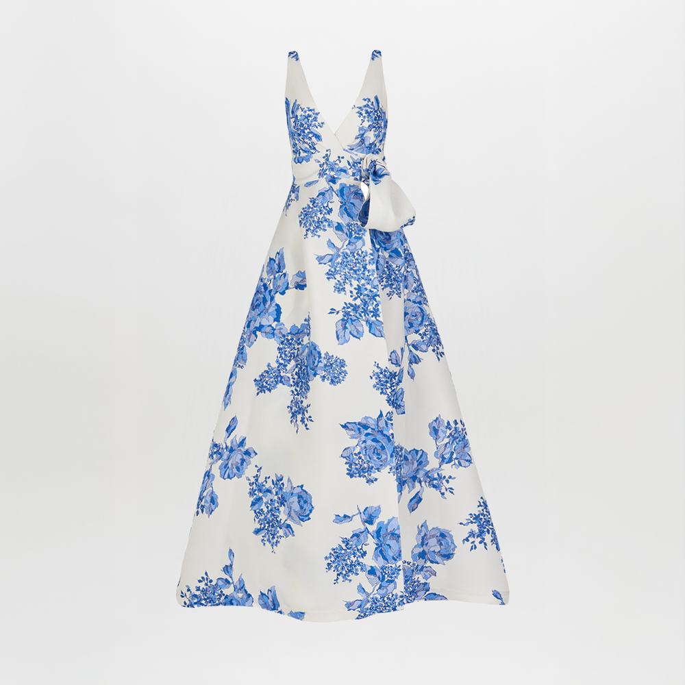 White sleeveless Logan Dress Blue Rose Motif with a bow on the shoulder, displayed against a white background.