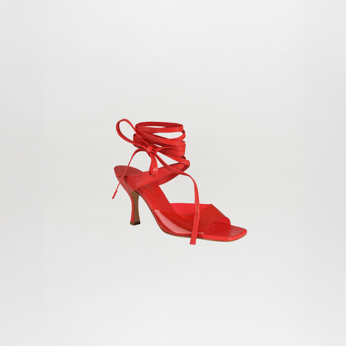 A single red Marlene Heel, crafted from Italian calf leather with a square toe and long ankle wrap straps, shown against a plain white background.