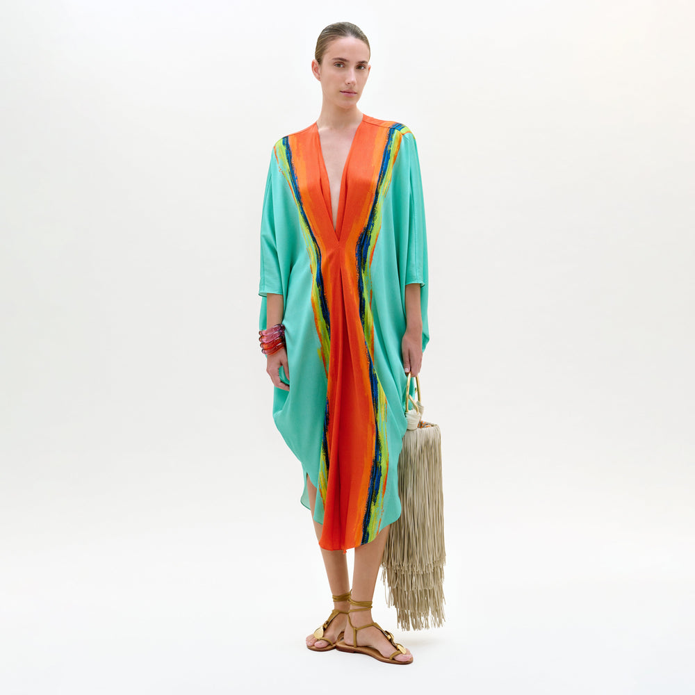 Woman wearing a colorful dress with a white background