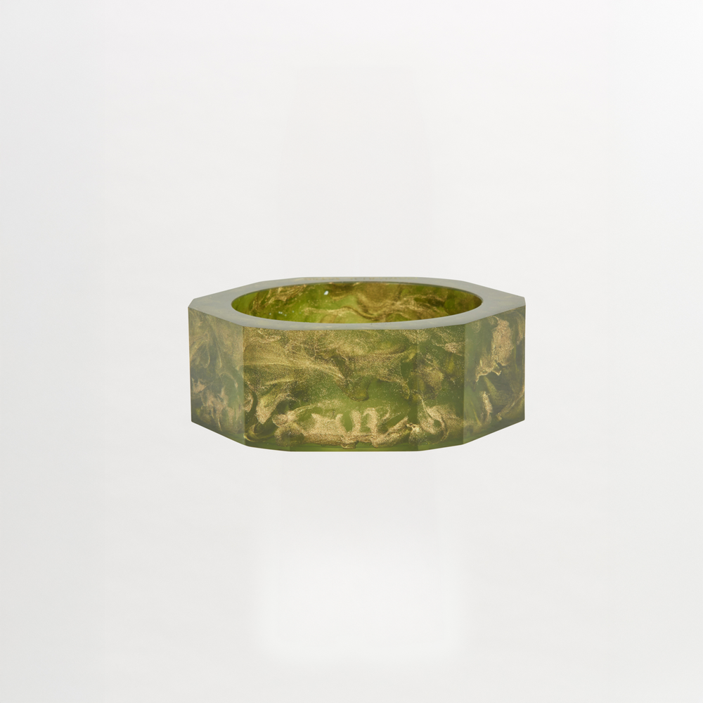 The Ruth Bangle Green, a hexagonal bowl featuring a sophisticated marbled pattern in green, elegantly rests on a plain white background. It's ready to ship just two weeks after you place your order.