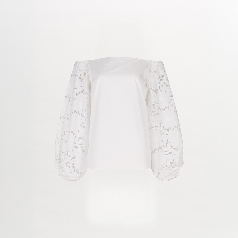 A white Stephanie Blouse White with lace bishop sleeves.