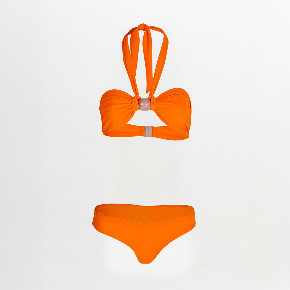 A Valderice Bikini Top + Fermina Bikini Bottom Orange set featuring halter top and seamless bottom, set against a white background.
