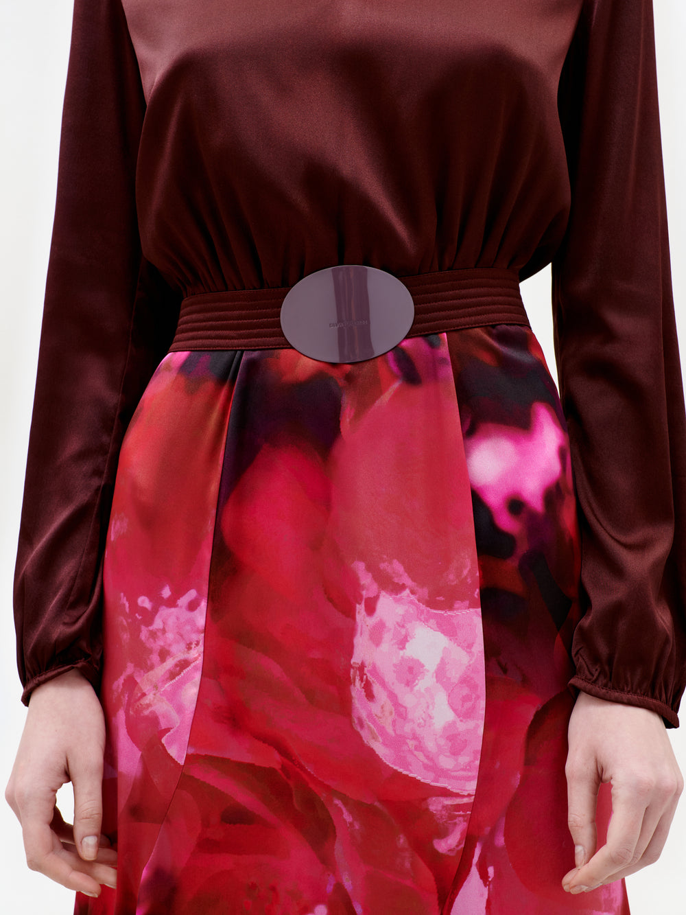 Red floral dress with a belt on a white background