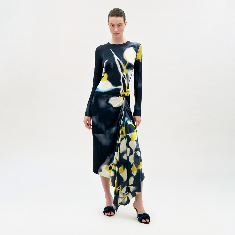 Woman wearing a floral dress on a white background