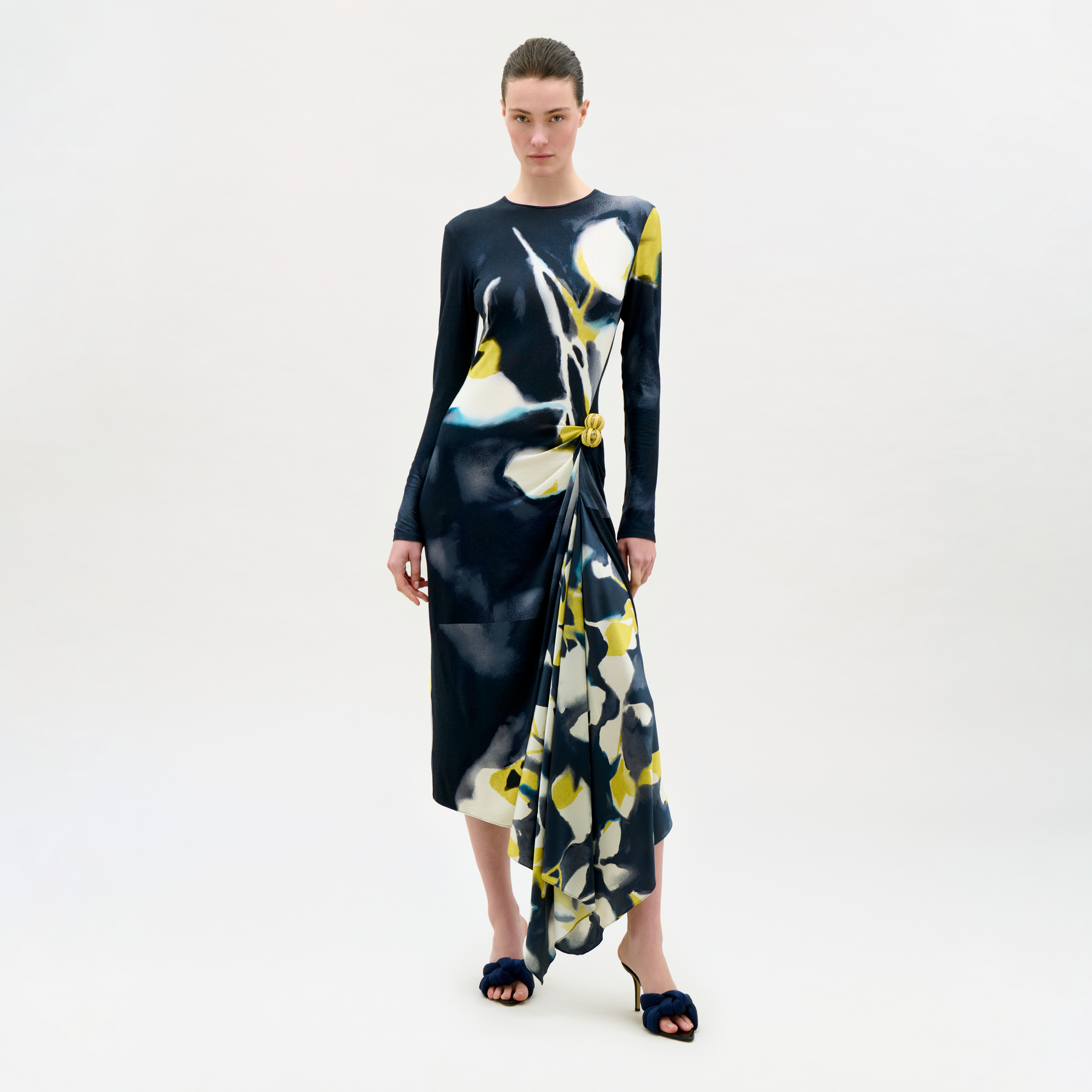 Woman wearing a floral dress on a white background