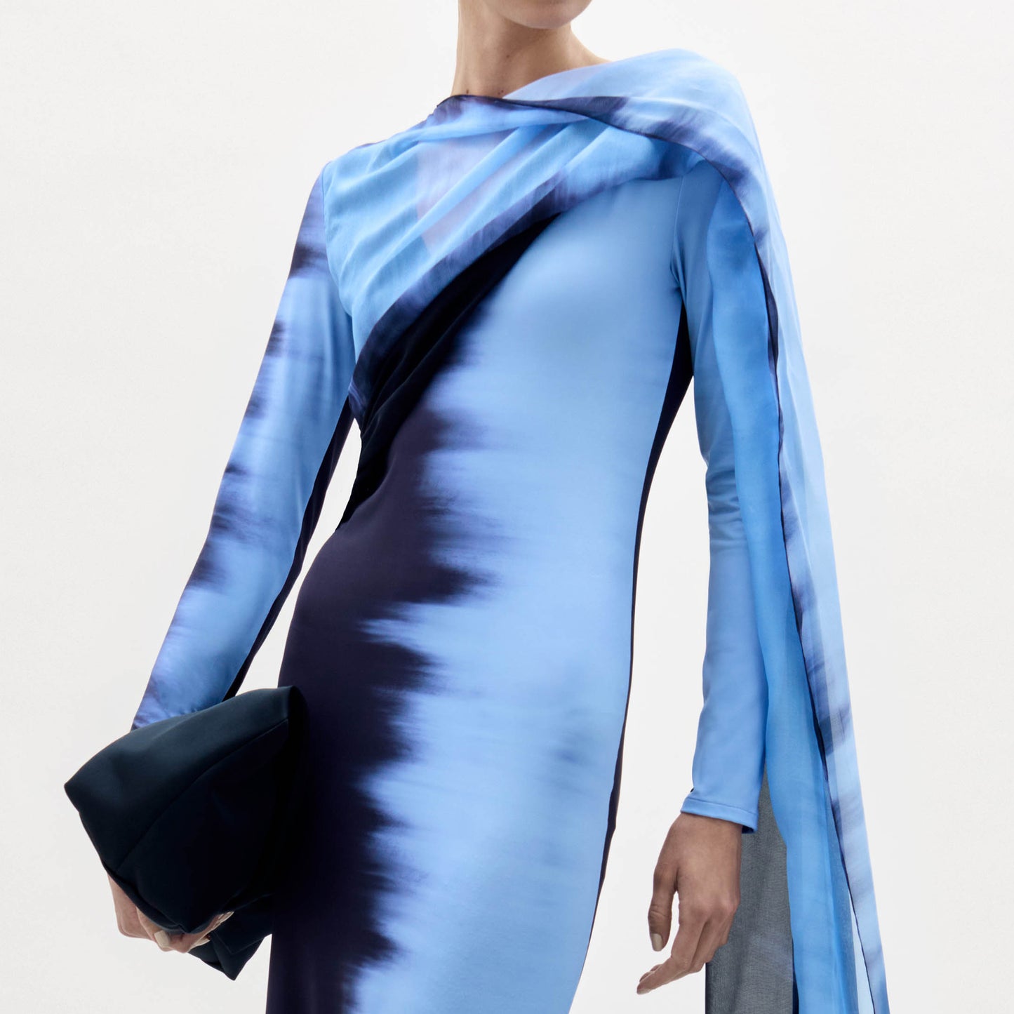 Blue and black patterned dress with a plain background