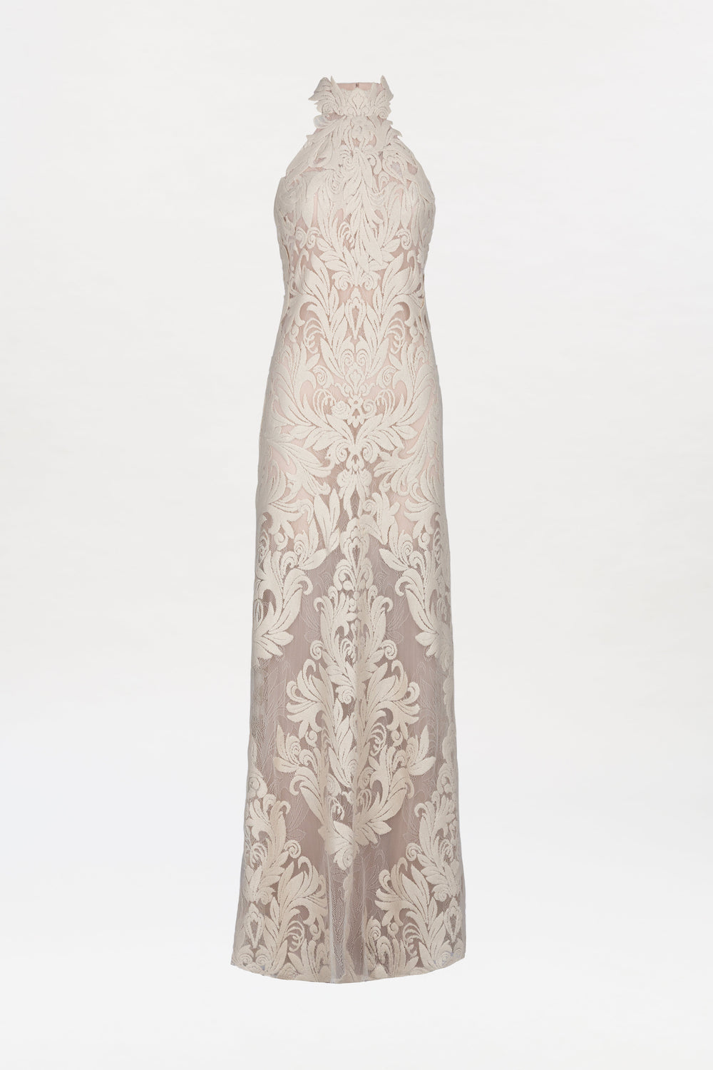 The Marcia Dress is a sleeveless, floor-length cream gown featuring a high neckline and intricate floral embroidery on sheer fabric, showcased against a plain white background.