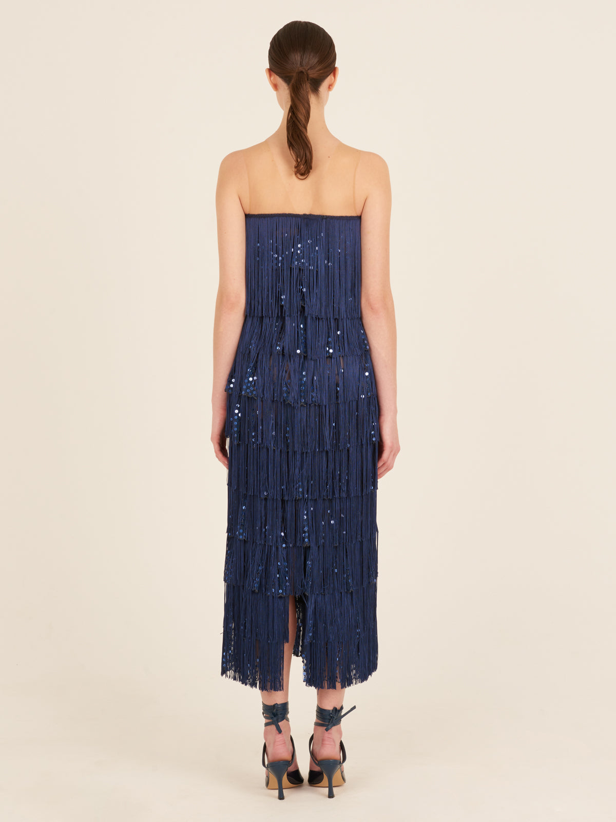 A Salome Dress Navy with fringes and sequins.