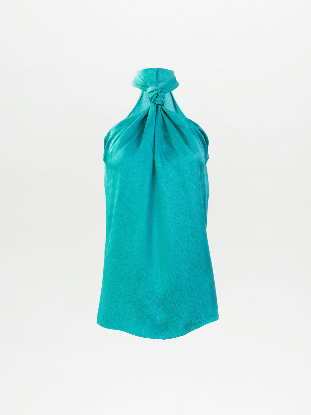 The Teagan Blouse is a sleeveless turquoise halter top featuring a stylish knot neckline detail, made in Colombia and shown on a plain white background.