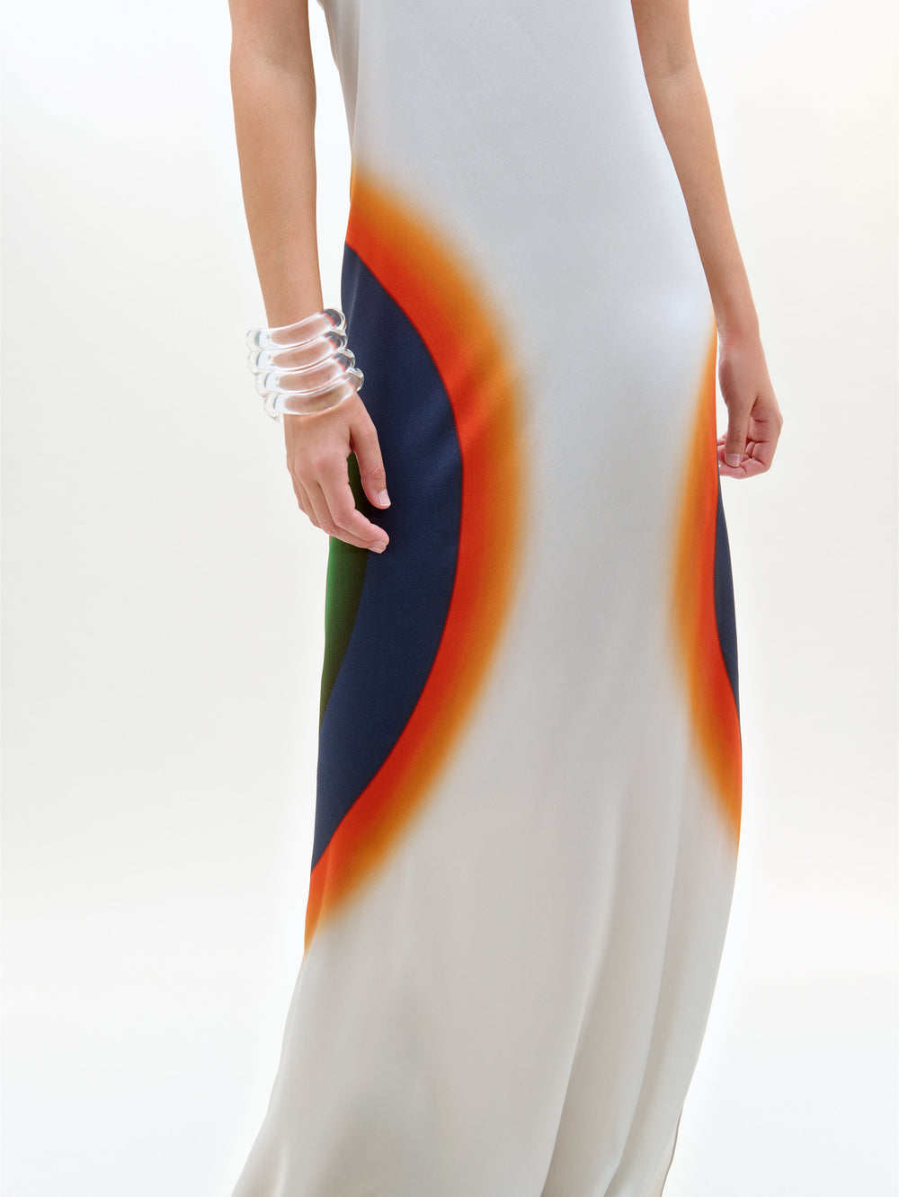 Long white dress with colorful abstract pattern on a white background
