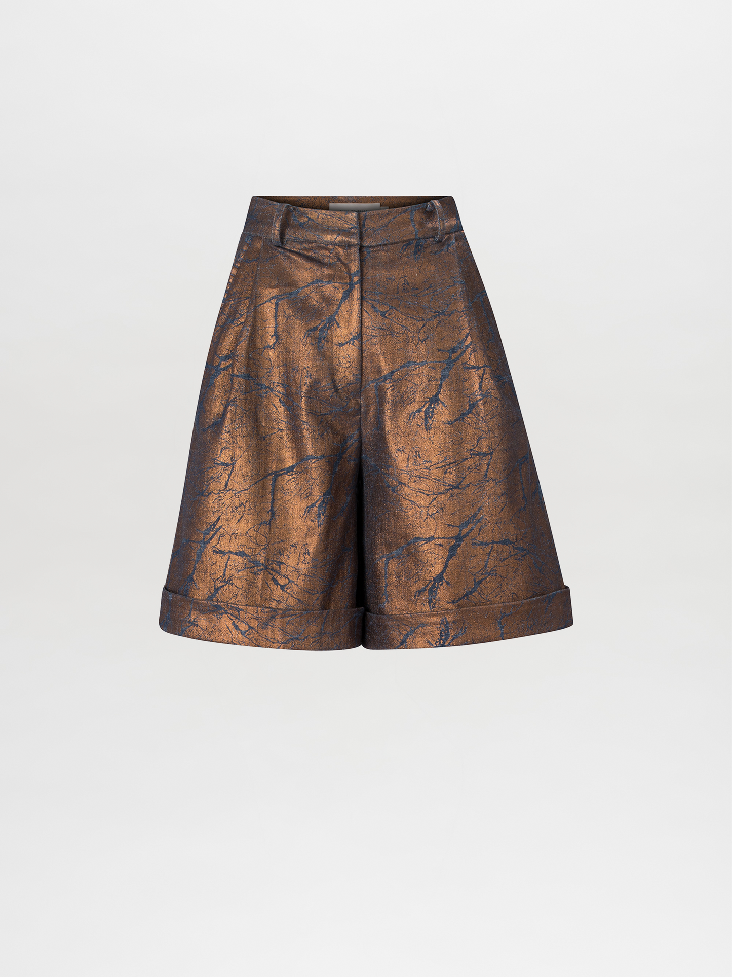 The Bimba Bermuda Metallic shorts boast a high-waisted, flared silhouette, highlighted by abstract dark blue patterns and a stylish cuffed hem.