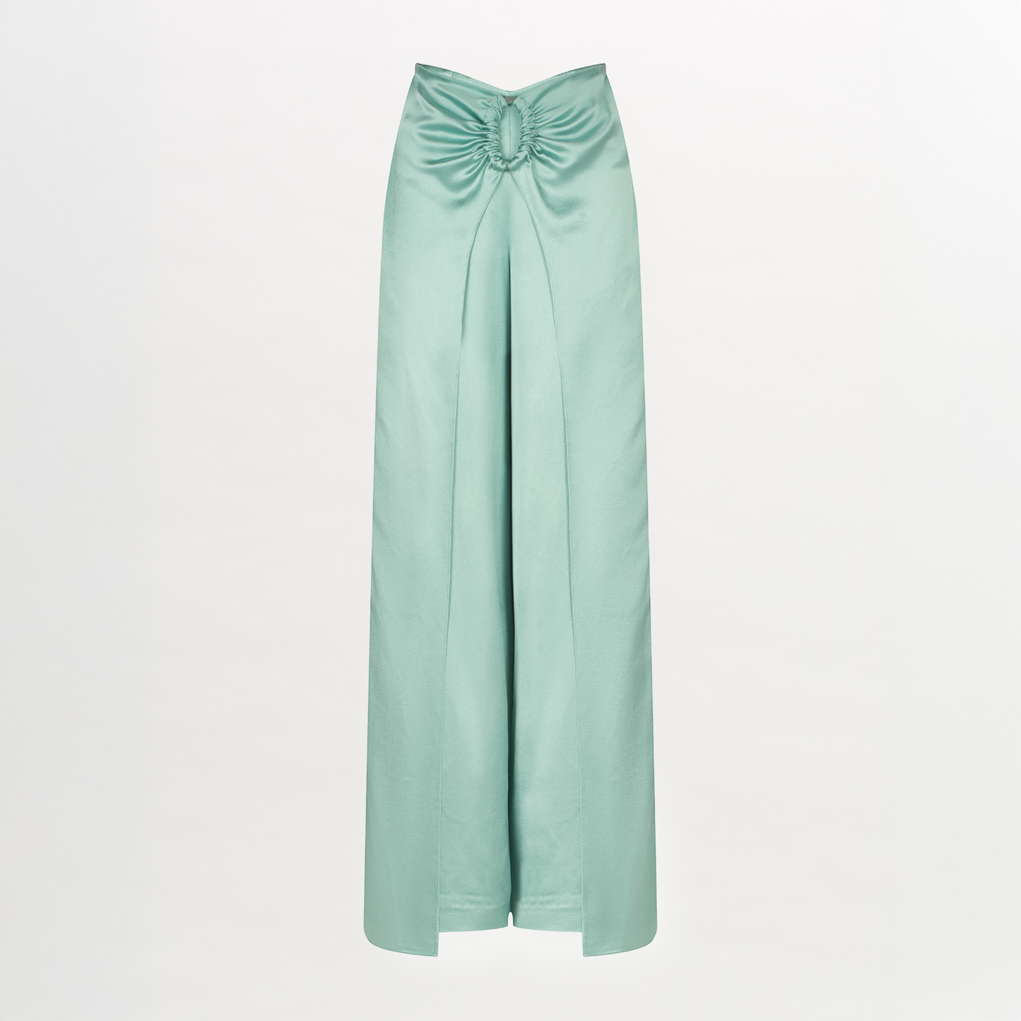 The Belma Pant in light green satin features a draped front, gathered knot at the waist, subtle oval ring detail, and a chic front slit, shown against a plain white background.