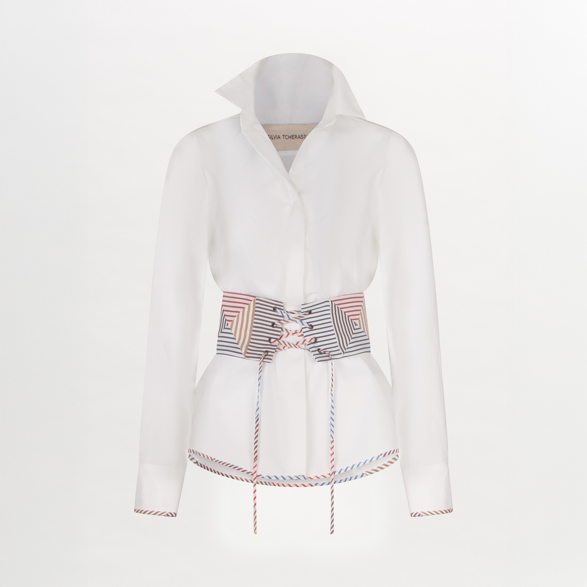 A Berenice Blouse White with a colorful belt and a fitted silhouette.