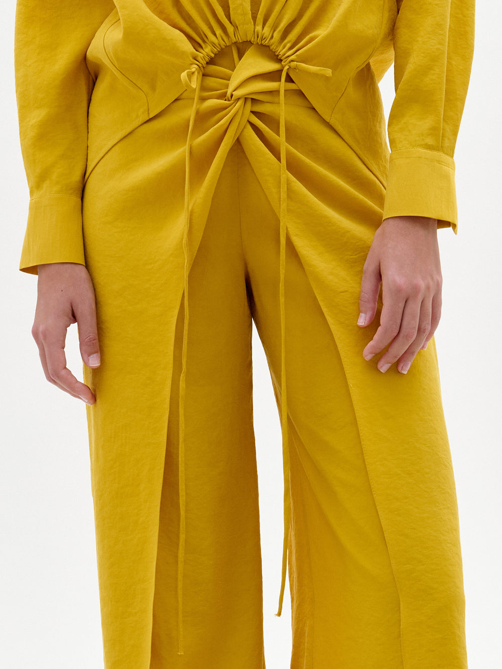 Yellow pants with matching yellow blouse