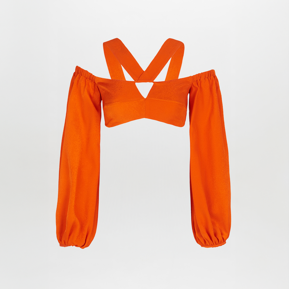 The Carole Top Bright Orange is an off-shoulder cropped top with long, billowing sleeves and wide crisscross straps at the back, shown against a plain white background.