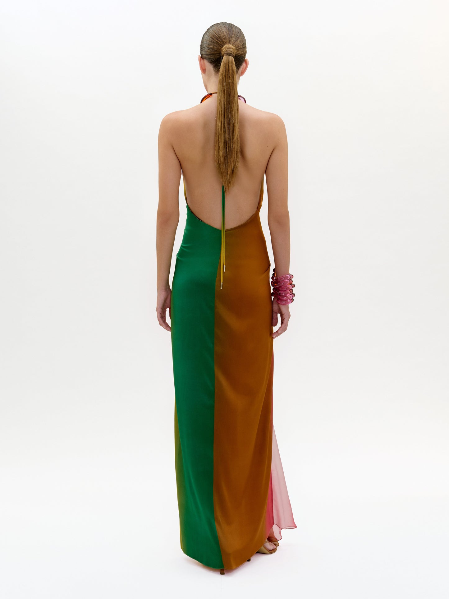 Woman wearing a colorful dress with a white background