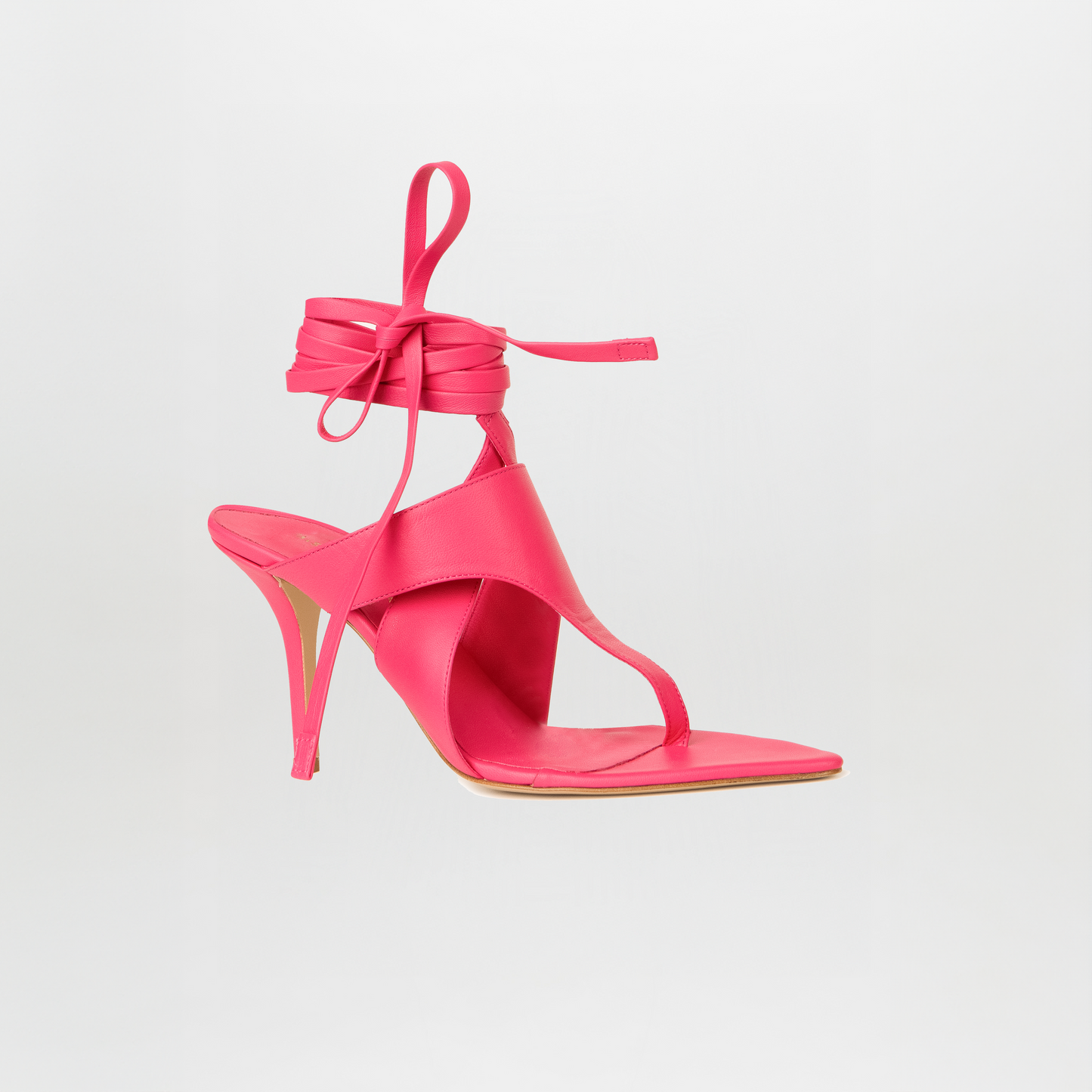 The Domenico Heels Fucsia by GIA Couture is a bright pink high-heeled sandal with Italian leather, a pointed toe, ankle wrap straps, and a thin heel, shown against a plain white background.