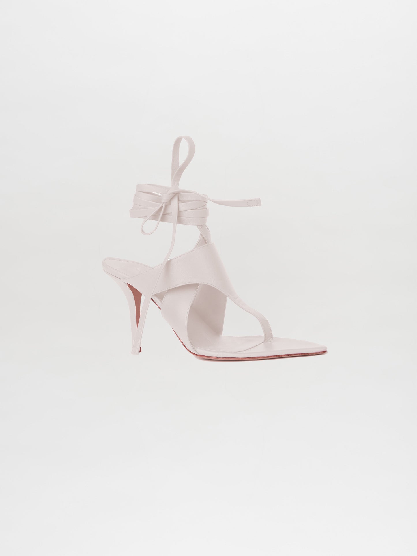 The Domenico Heels White, crafted from Italian leather, are elegant high-heeled sandals with chic ankle wrap straps.