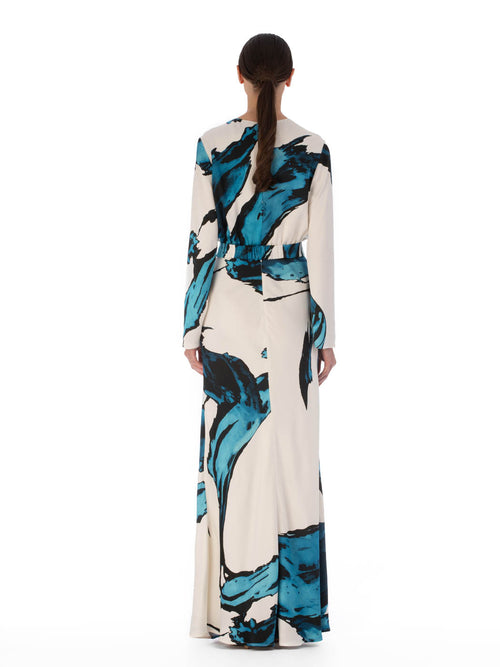 Fadia Dress Multi Abstract Waves with a circular resin buckle at the waist, isolated on a white background.