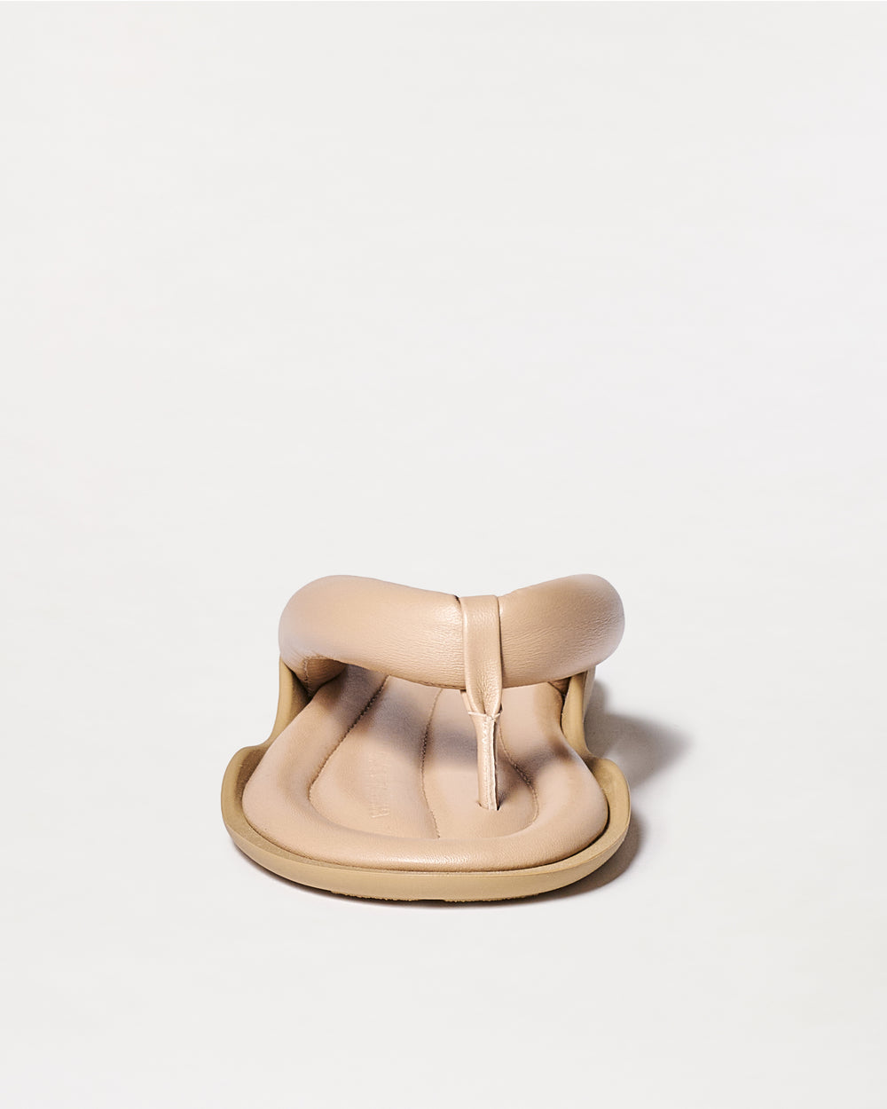 Beige sandal on a white background