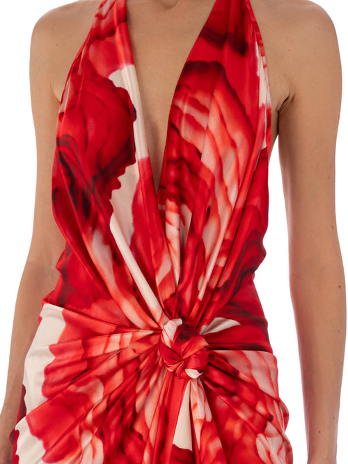 A Guadalupe Dress Multi Abstract Rouge with a halter neckline and a twisted front design, displayed on a white background.