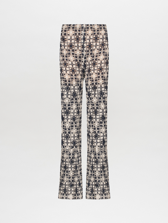 A Joan Pant Navy White Crochet with a pattern in lace fabric.