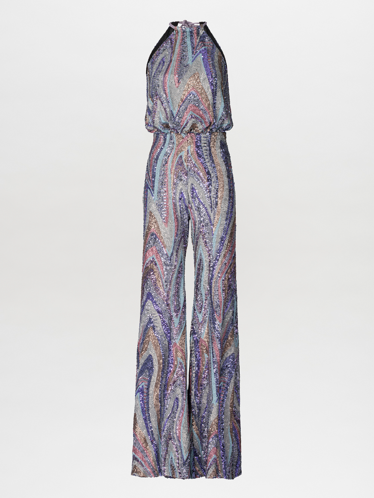 Against a plain blue background, a person stands poised in the Lauretta Jumpsuit Sequin Waves, featuring a sleeveless, high-neck design with a colorful, swirling pattern. The outfit showcases wide-leg pants and comes with a belt—perfectly capturing the style for upcoming events between August 19th and September 2nd, 2024.