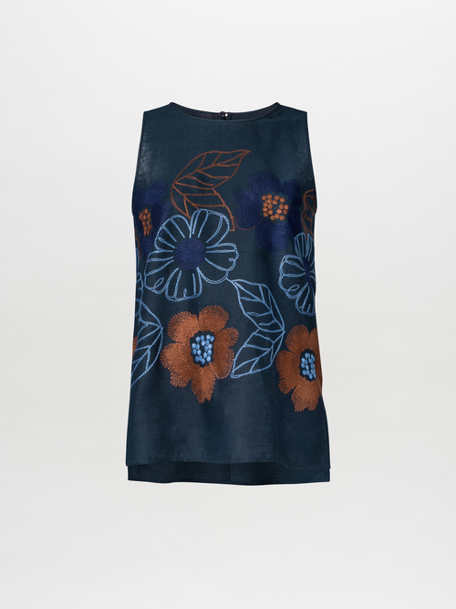 The Leonora Blouse Navy is a sleeveless top adorned with exquisite floral embroidery in vibrant shades of orange, blue, and brown on a solid navy fabric.