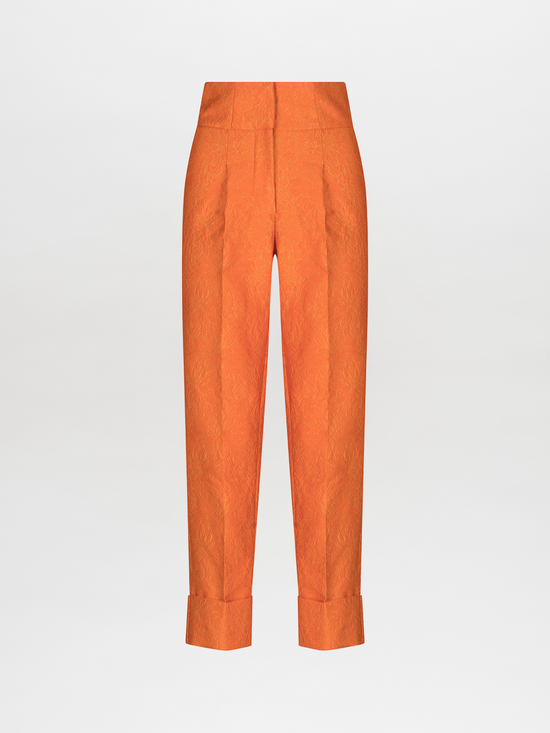 A pair of Moad Pant Orange Petal with pleating details.