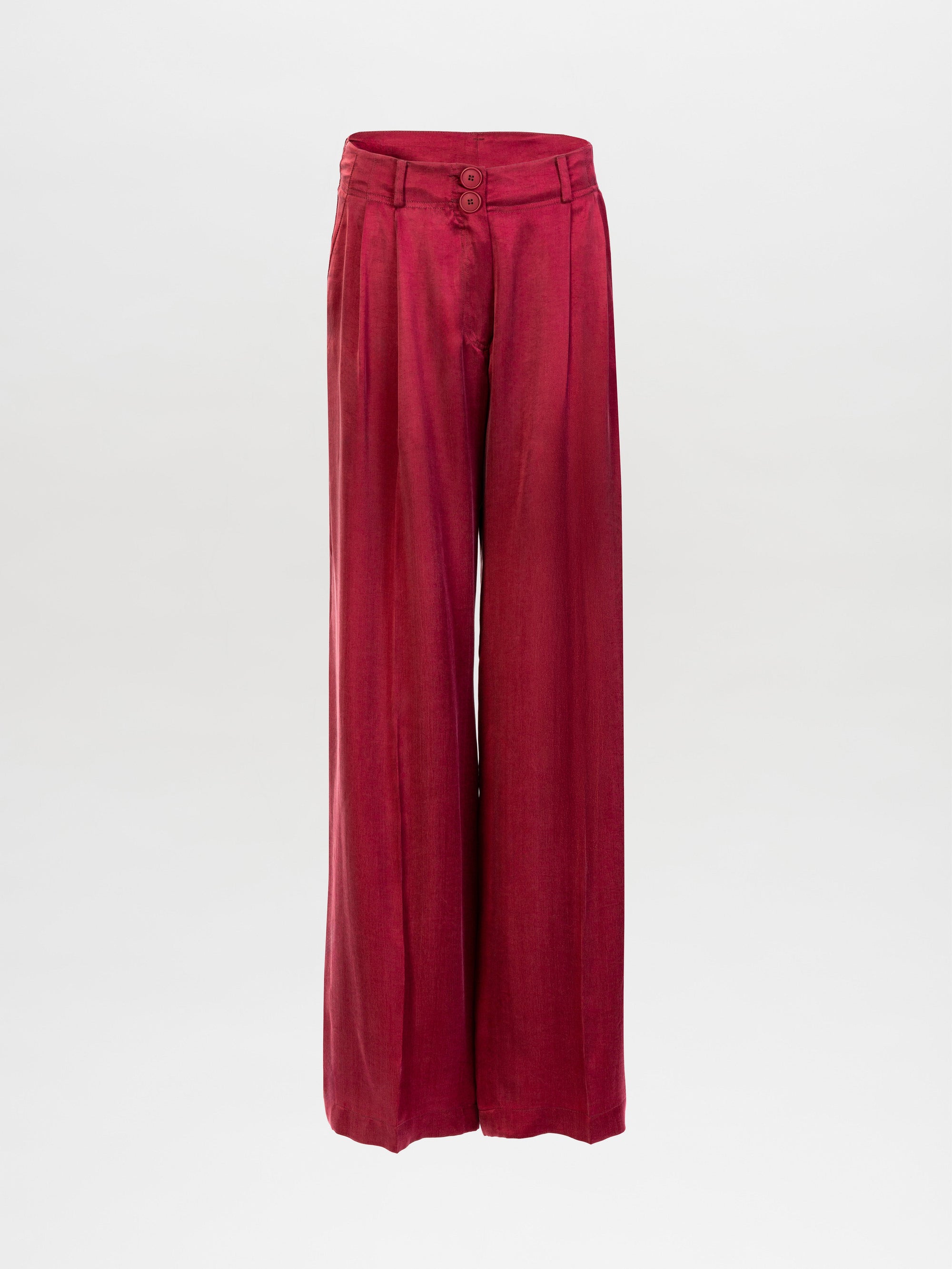 The Opal Pant is a high-waisted, wide-leg red trouser made from premium Italian fabric with front pleats, belt loops, and a double-button closure, shown on a plain white background.