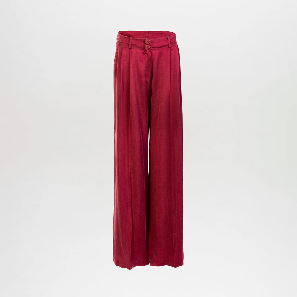 The Opal Pant features a high-waisted, wide-leg silhouette in vibrant red Italian fabric with double button and zip closure, belt loops, and waist pleats, shown against a plain white background.