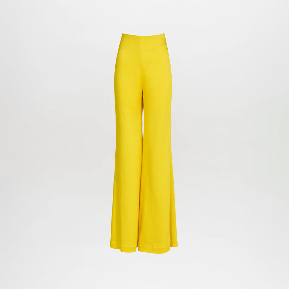 The Palermo Pant Yellow features a high-waisted, wide-leg flare design with a smooth, tailored fit at the waist and hips, flaring out at the hem. Displayed against a plain white background, these pants create a bold and striking silhouette.