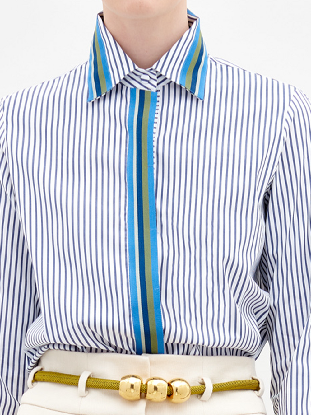 A person stands against a plain background wearing the Premium in color Blue stripes