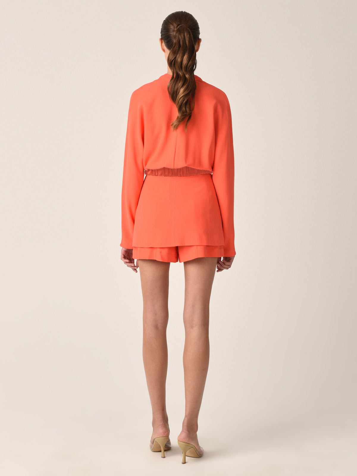 Bright Vogogna Jacket Tangerine with a cinched waist, belt detail, and flap pockets, displayed on a white background.