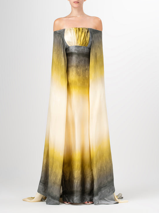 A yellow Cailin Dress Amber Watercolor with a cape and an invisible zipper.