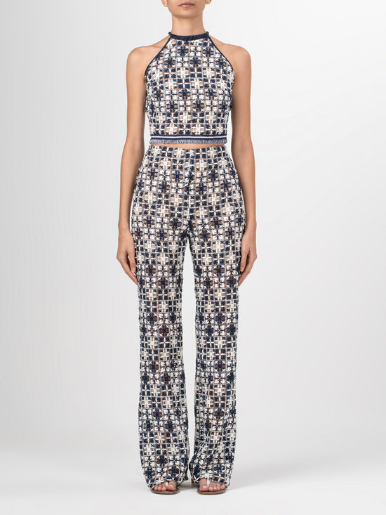 A Joan Pant Navy White Crochet with a pattern in lace fabric.