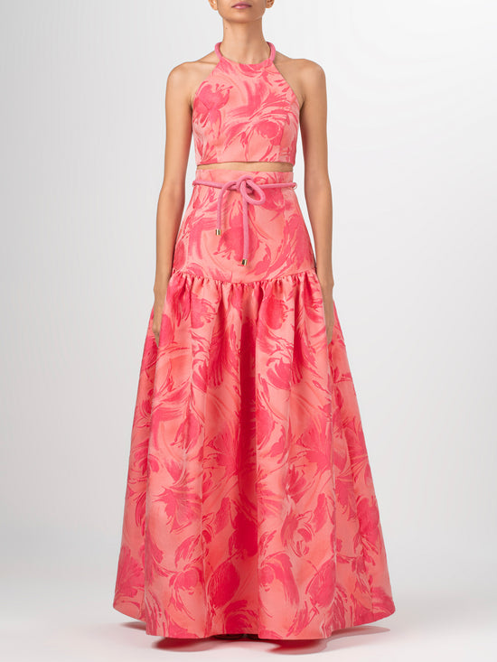 A Teodora Skirt Fuchsia Pink with a bow at the waist in textured jacquard fabric.