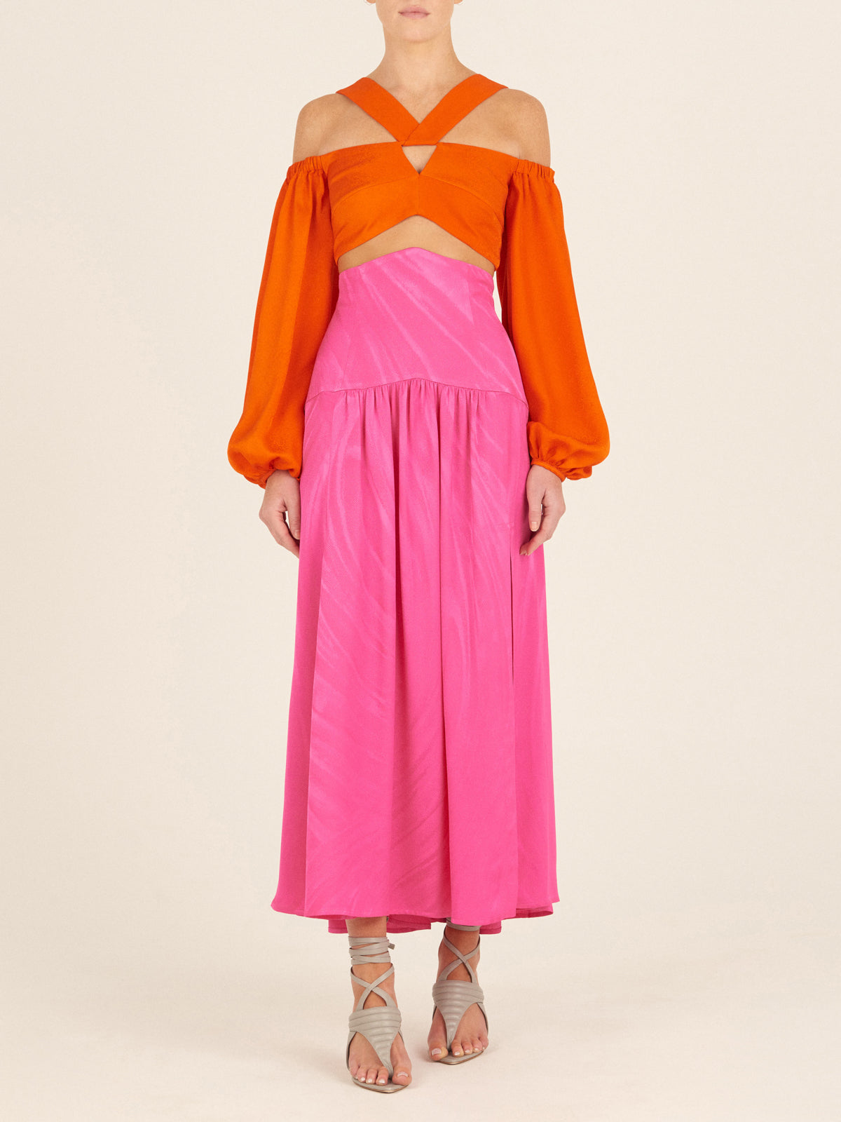 Bright pink sleeveless dress with a high neckline and a full-length, Callie Skirt Fuchsia, displayed on a white background.