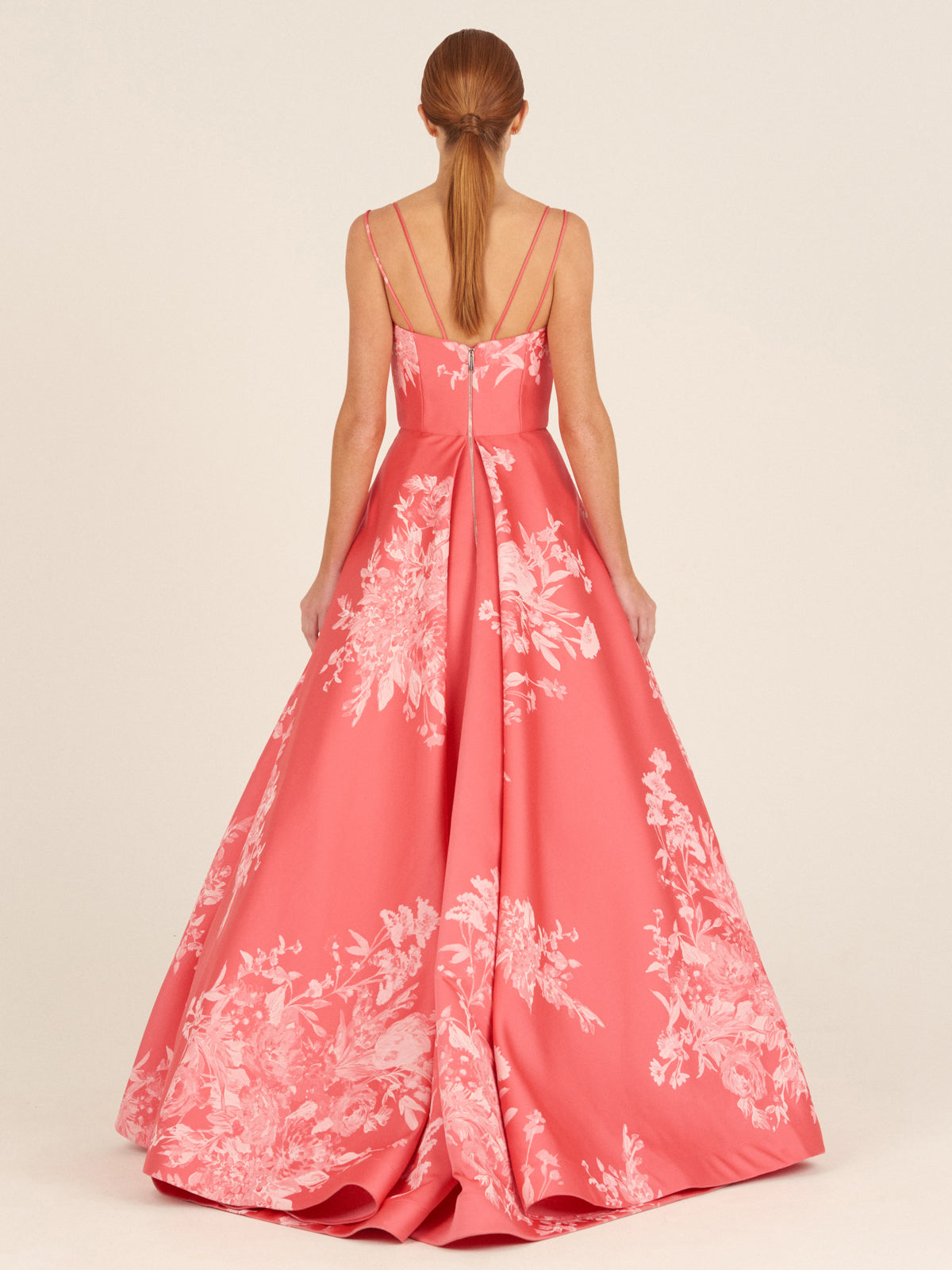 Strapless salmon Julene dress with white floral embroidery design.