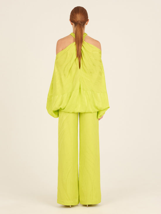 A woman's Casey Pant Verde Lime, wide-leg, flattering drape pants.
