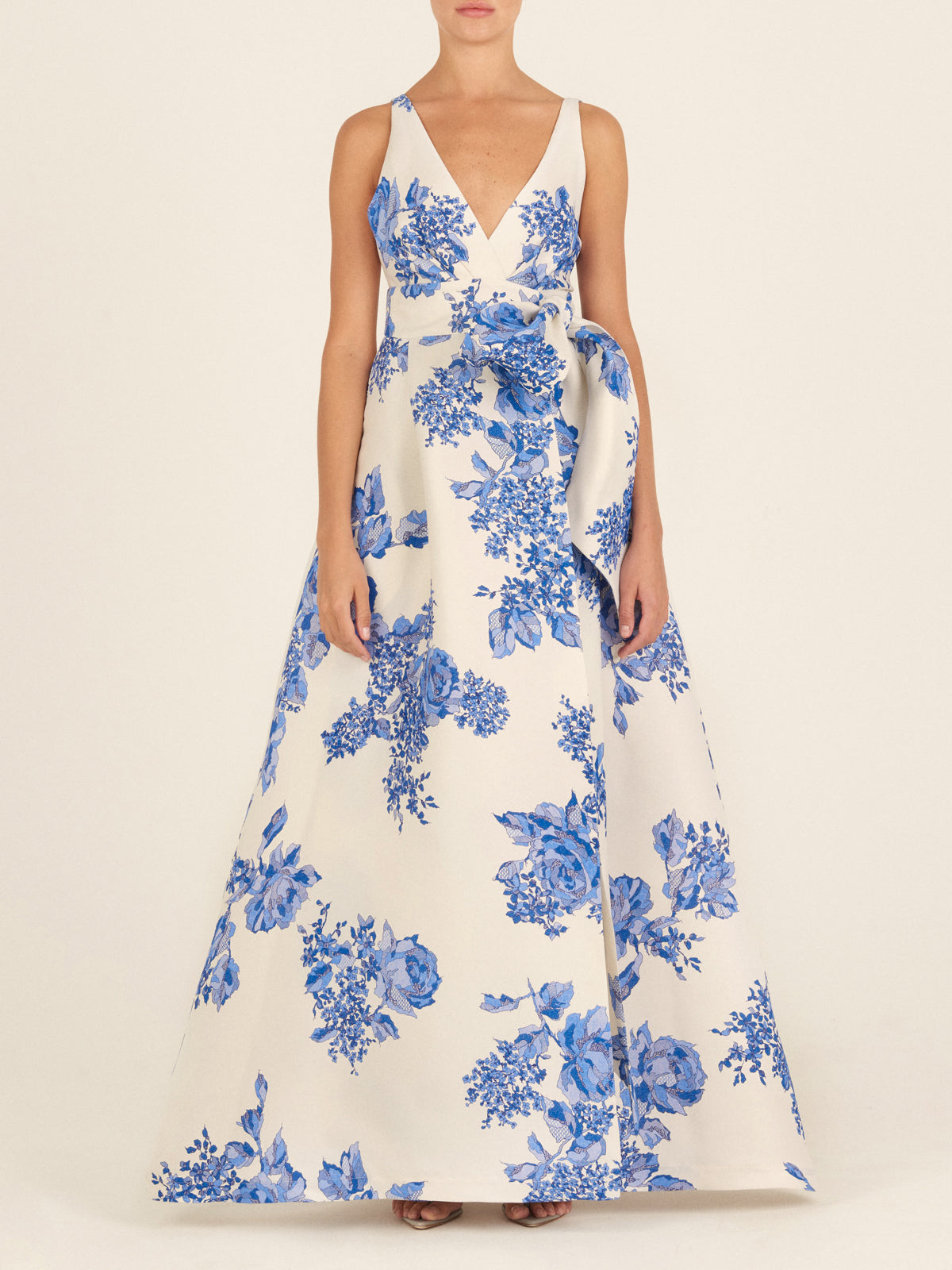 White sleeveless Logan Dress Blue Rose Motif with a bow on the shoulder, displayed against a white background.