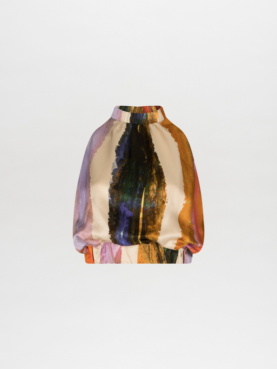 A Stefano Blouse Orange Orchid Abstract Stripes with an abstract multicolor print on a white background.