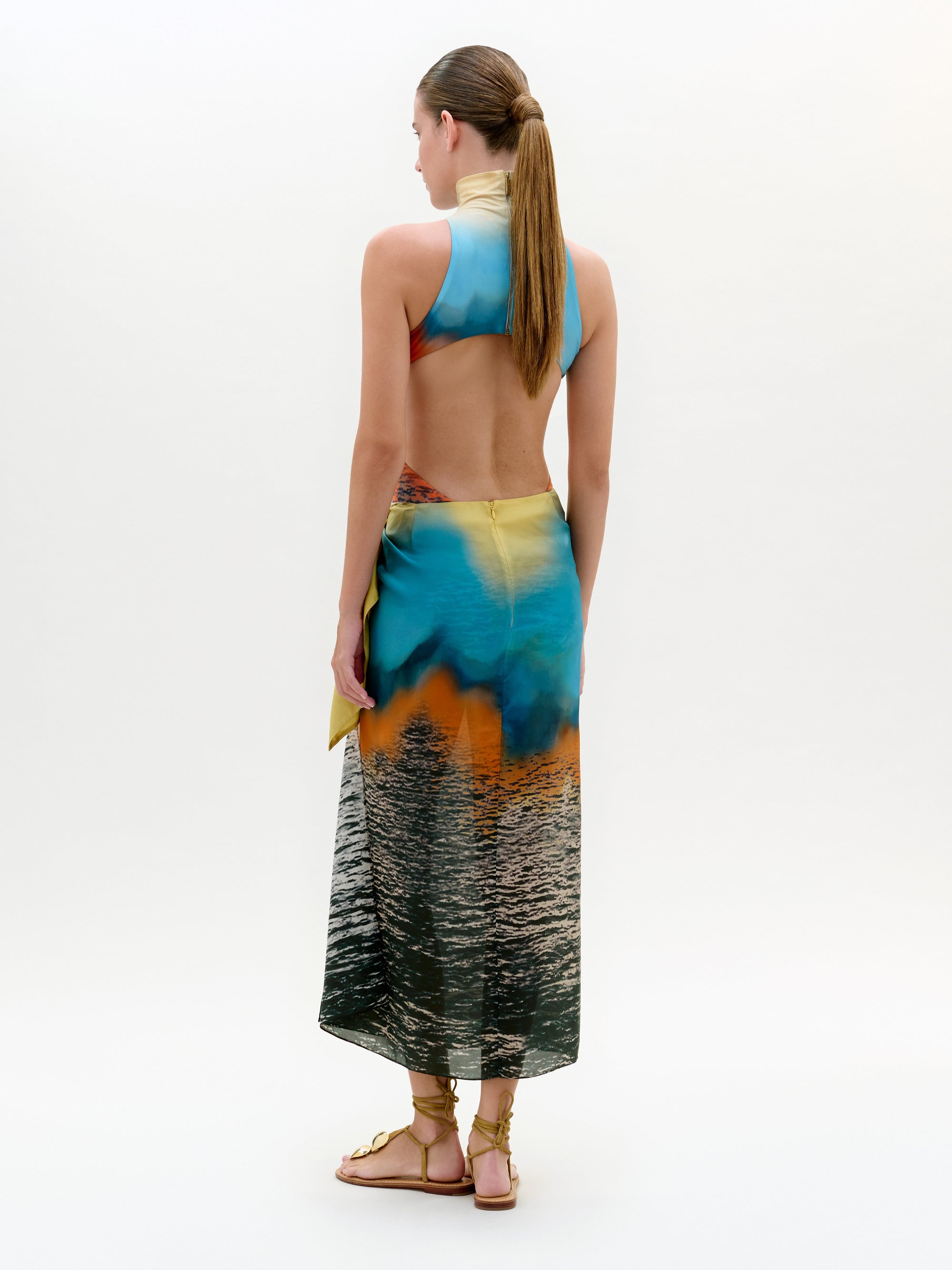 Woman wearing a colorful dress with a white background
