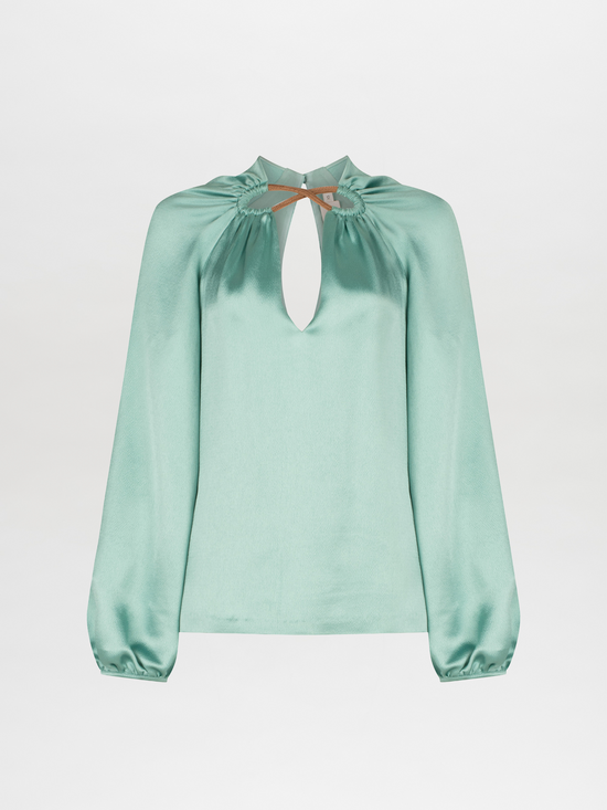 A Ximena Blouse Aqua with a keyhole neckline.