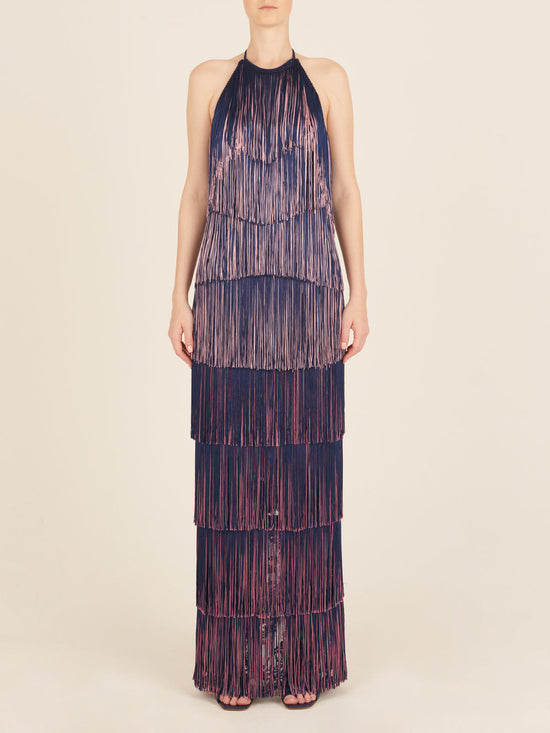 A floor-grazing fringed Paris Dress Navy with a touch of glamour in blue and pink hues.