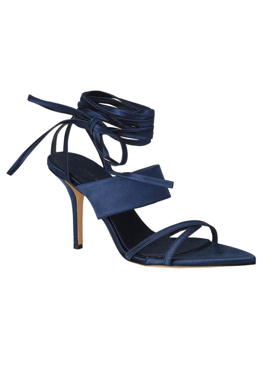 A pair of Jimena Heels Navy from the Silvia Tcherassi collection with straps and ribbon ties on a white background.