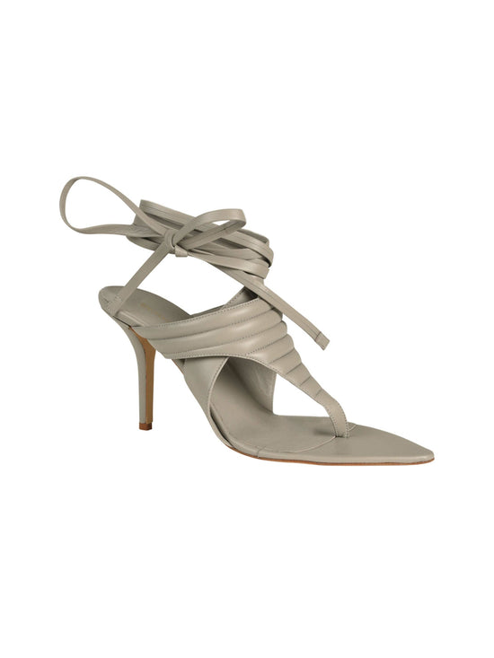 A single Dalila Heels Grey high-heeled sandal with crisscross straps and ankle ties against a white background.