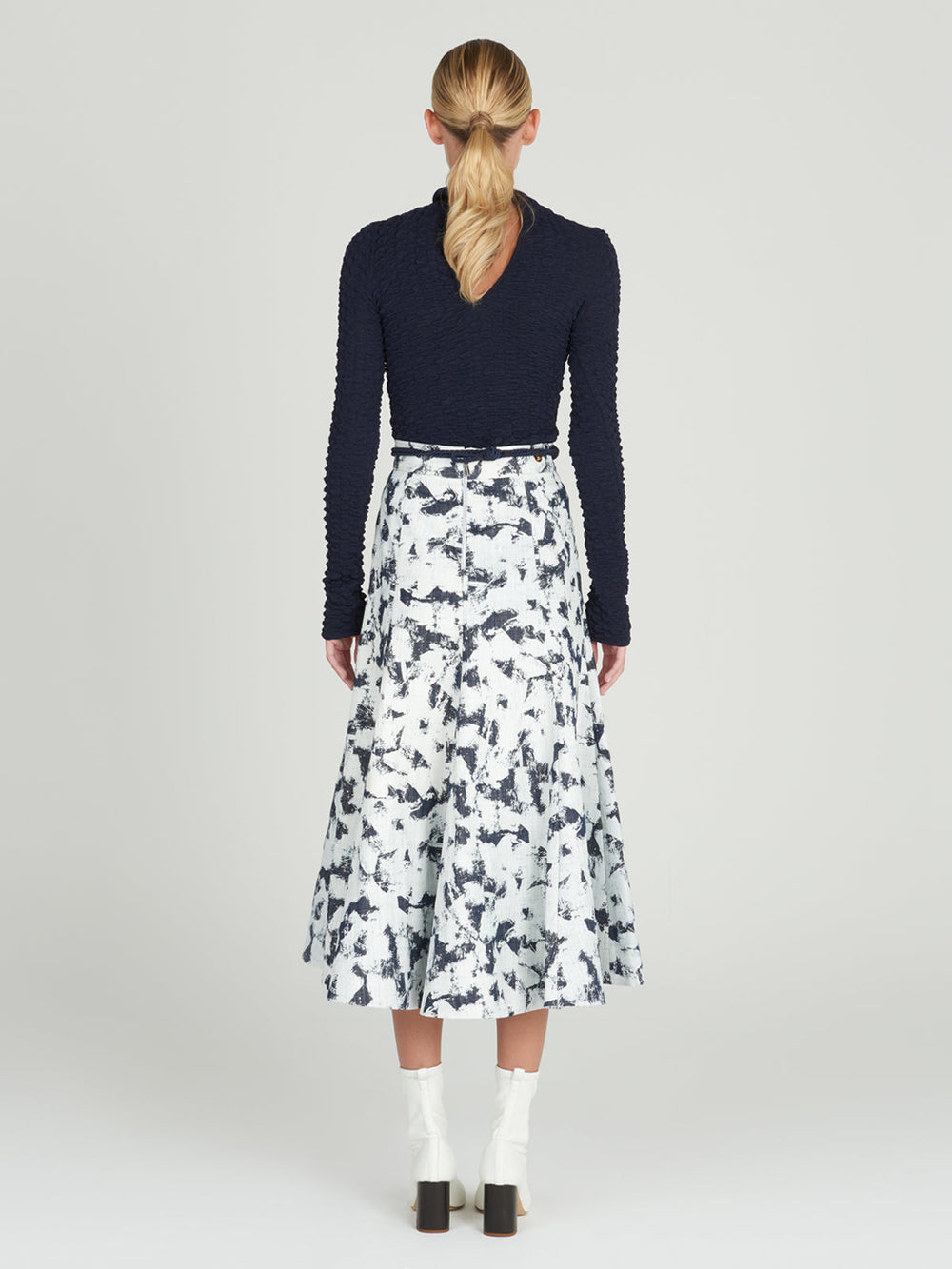 A women's long-sleeved Jari Top Navy, crafted from jacquard fabric, making it a versatile piece for Resort 2024.